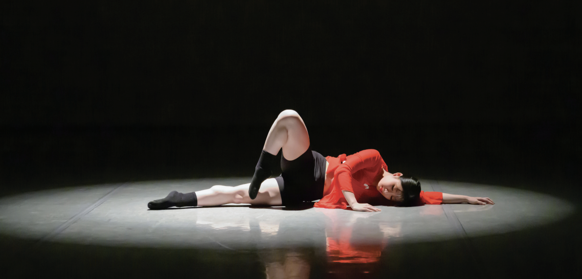 San Jos&#233; State University third-year justice studies student Deborah Lee lies down during her first outreach ballet showcase &#8220;Zohar.&#8221;